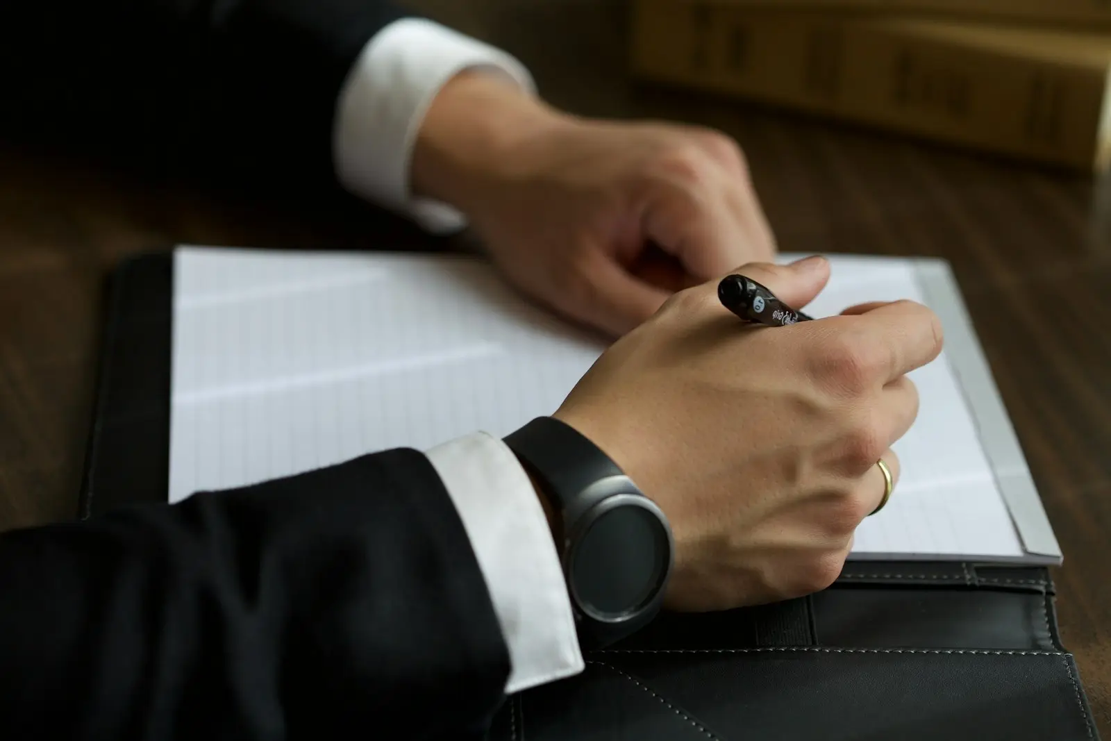 Signing loan documents at a meeting