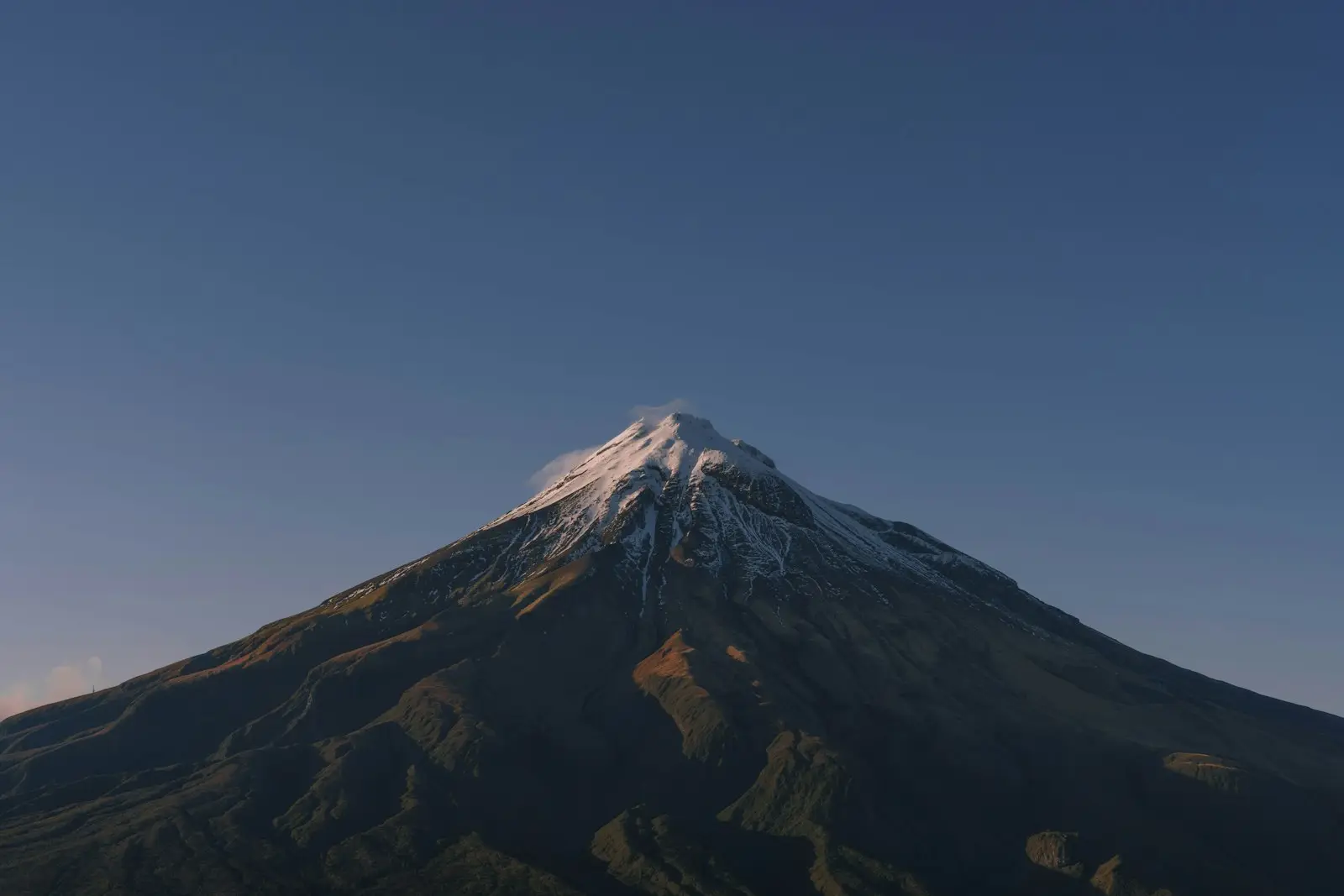 Snow-capped Mount Taranaki above the Taranaki plains